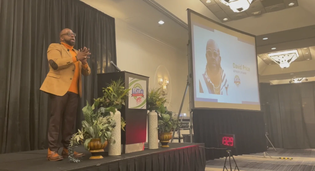 Photograph of DK Price giving a presentation.