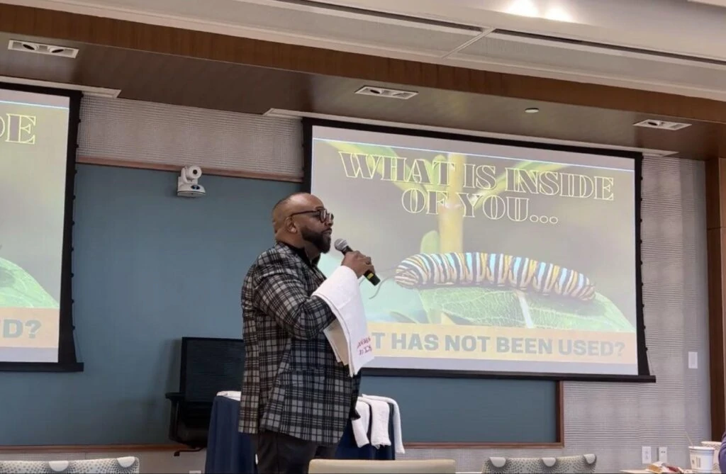 Photograph of DK Price giving a presentation.