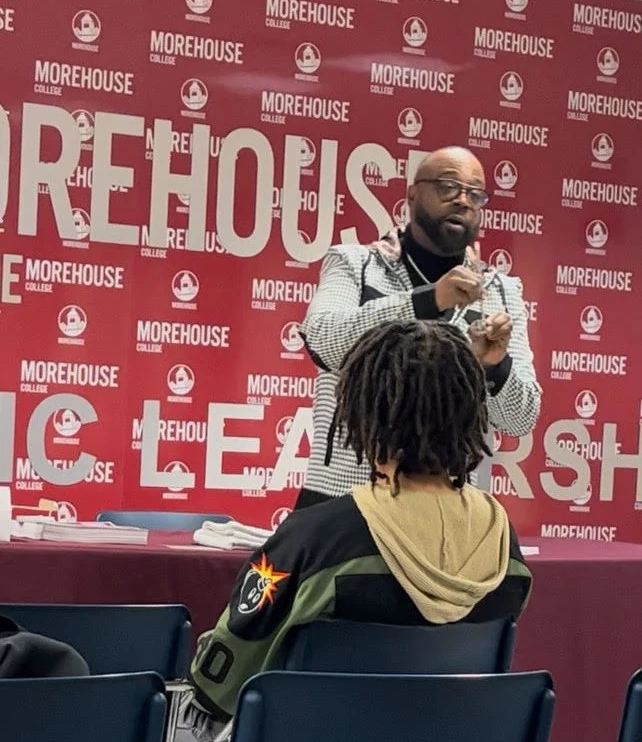 Photograph of DK Price giving a presentation.
